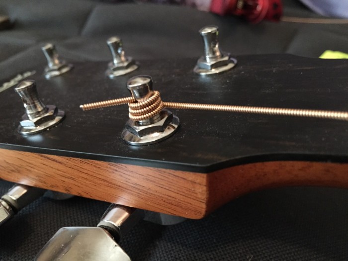 stringing a guitar - winding